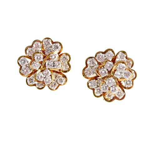 Pair of diamond and gold floral cluster earrings by Van Cleef & Arpels, made in France probably for New York retail, the flowers of stylised hydrangea design,